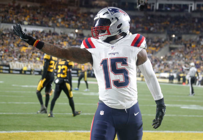 Dec 7, 2023; Pittsburgh, Pennsylvania, USA; New England Patriots running back Ezekiel Elliott (15) celebrates after scoring a touchdown against the Pittsburgh Steelers during the first quarter at Acrisure Stadium.